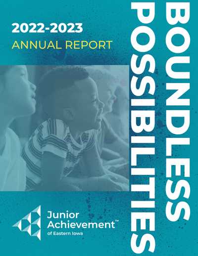 Front page of JAEI 2022-2023 annual report titled Boundless Possibilities. Teal with dark blue paint splatter background, photo of three children looking forward and smiling/laughing with light blue overlay. White JAEI logo underneath photo