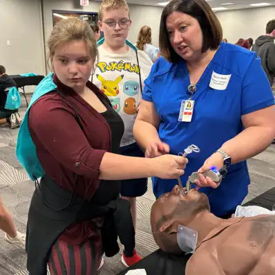 Image of a student and volunteer