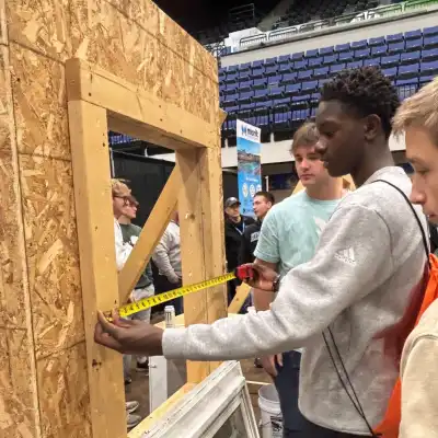 Image of a student measuring a window