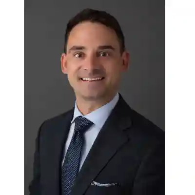 Image of a man standing in front of a classroom