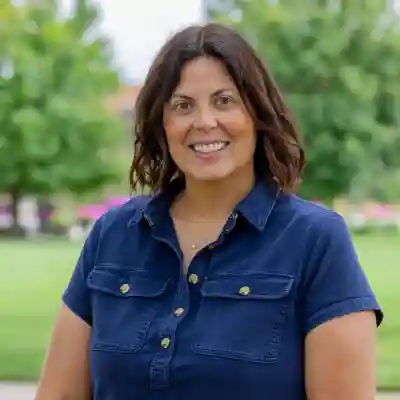 Image of a woman in a blue shirt