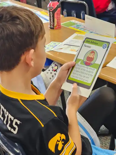 Student reading a card