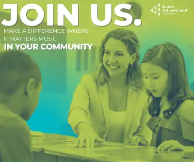 Image of a volunteer with students