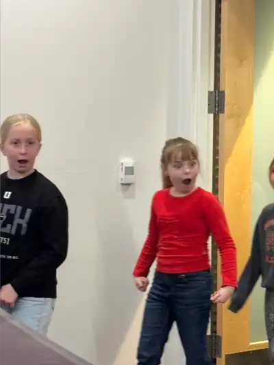 Children walking into a room