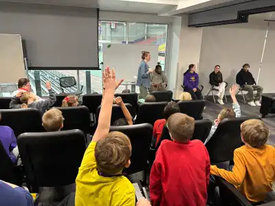 children raising their hands to ask questions