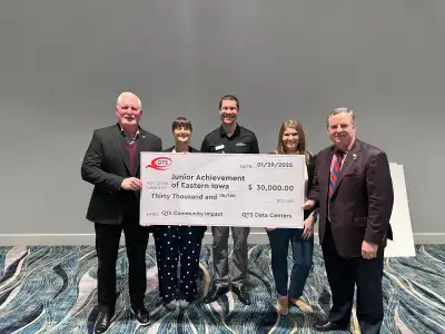 image of 5 people holding a large check