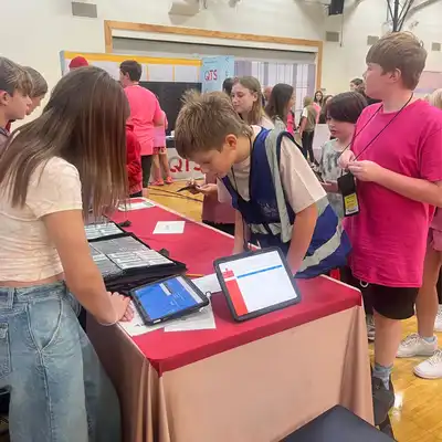 A group of students are participating in JA BizTown Mobile