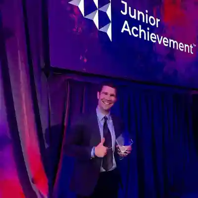 Man in suit receiving an award