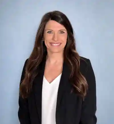 Image of a woman wearing a black blazer