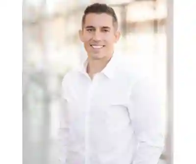 Photo of a man in a white shirt