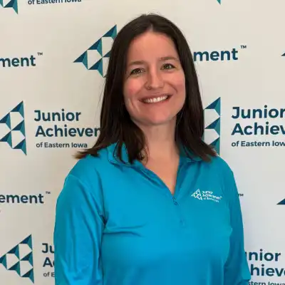 Image of a woman wearing a turquoise shirt