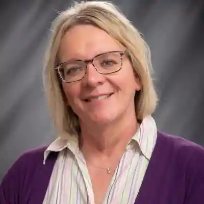 Image of a woman wearing a purple sweater