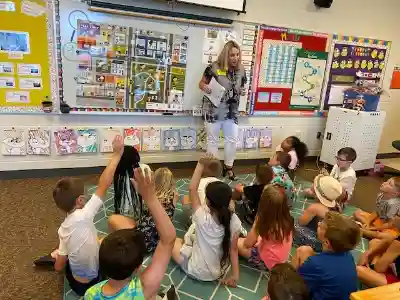 JA Classroom volunteer with students.