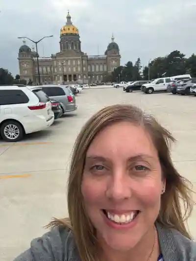 Image of woman in front of sign